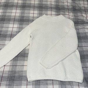 Adorable knit sweater with high neck! Looks a little oversized!